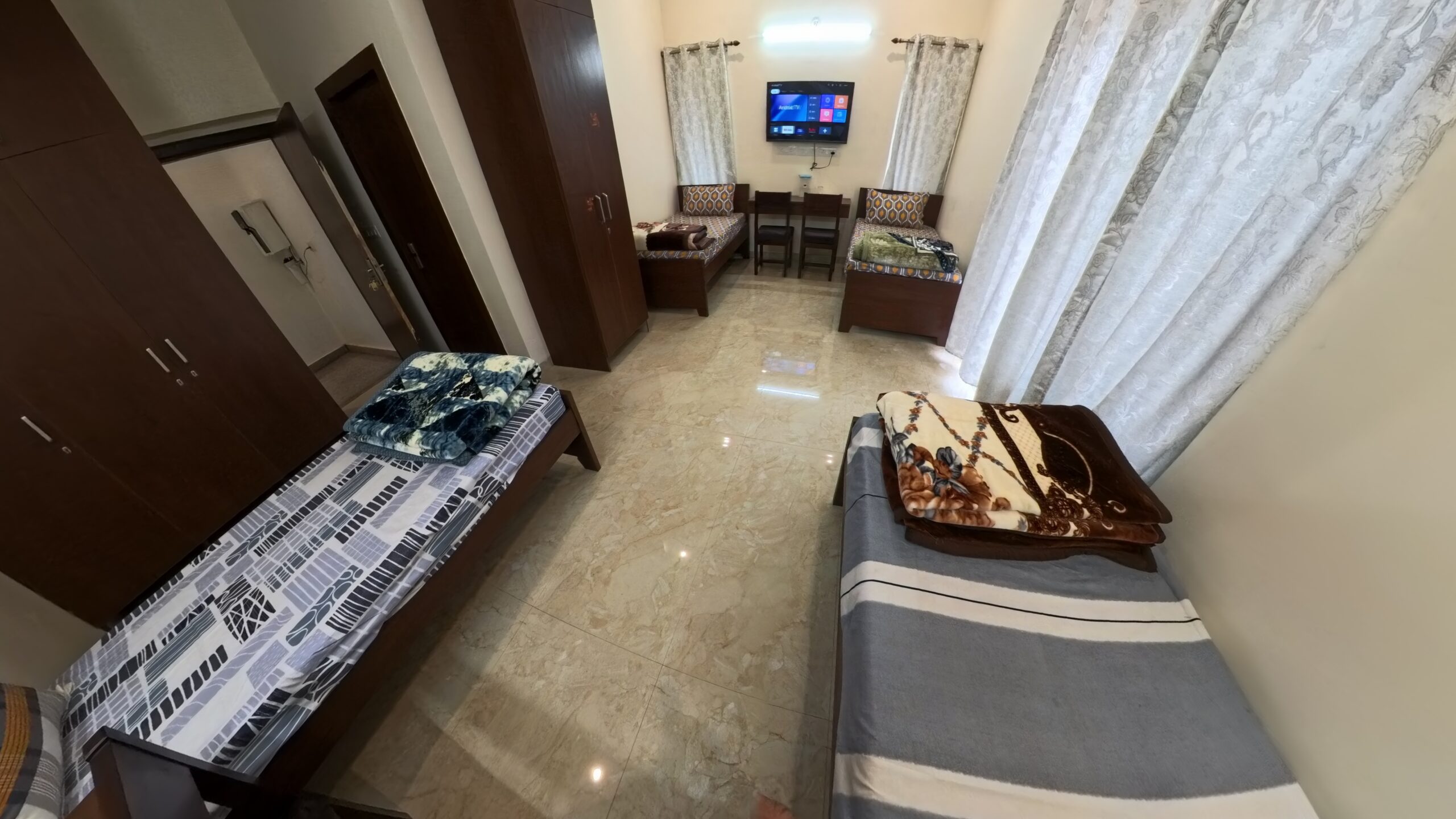 TV, Almira, Study Tables & Chairs & Bathroom, Quad Bed PG Girls Rooms; Shree Rudra Home Stays (a)